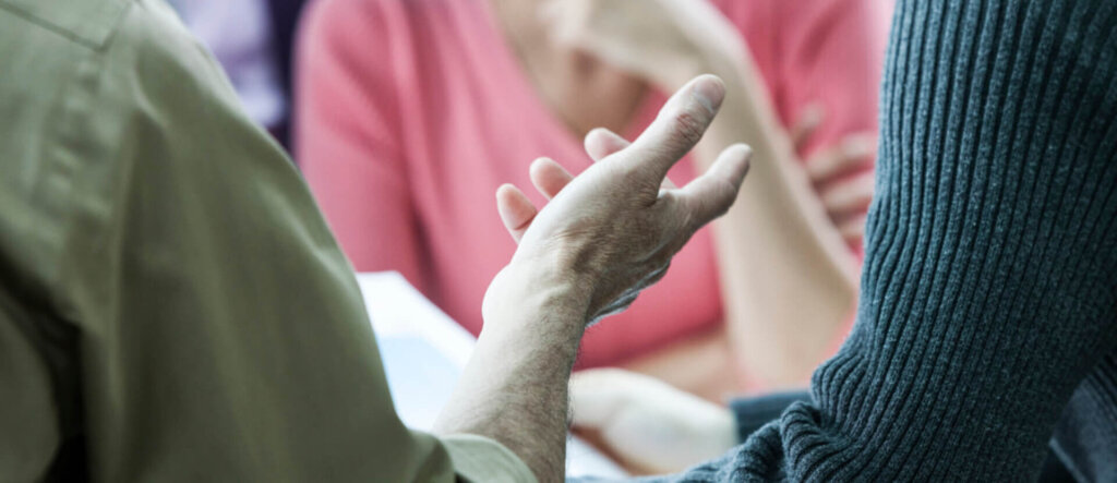USA,Closeup of a hand gesturing during a business meeting.